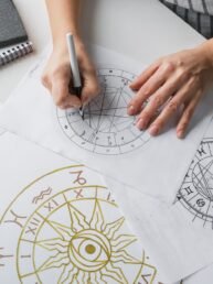 Astrology. Astrologer calculates natal chart and makes a forecast of fate Tarot cards